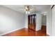 Bedroom with hardwood floors, a ceiling fan, and large wardrobe at 1278 Snug Harbor Dr, Casselberry, FL 32707