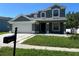 Charming two-story home featuring a well-maintained lawn and attached two-car garage at 1278 Snug Harbor Dr, Casselberry, FL 32707