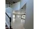 Spacious foyer featuring staircase, neutral paint and tile floors at 1278 Snug Harbor Dr, Casselberry, FL 32707