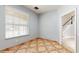 Bright living room features a window view and unique tile flooring at 1278 Snug Harbor Dr, Casselberry, FL 32707