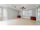 Spacious living area with tiled flooring, neutral walls, and abundant natural light from the large windows at 1278 Snug Harbor Dr, Casselberry, FL 32707