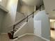 Foyer with a staircase that has dark wood treads and white risers at 1278 Snug Harbor Dr, Casselberry, FL 32707