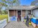 Cozy back porch featuring outdoor furniture and a grill at 1017 Mabbette St, Kissimmee, FL 34741