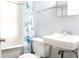 Cozy bathroom with a sink, toilet, and tub with shower at 1017 Mabbette St, Kissimmee, FL 34741