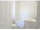 Simple bathroom with a shower-tub combo, toilet, and vanity sink at 1017 Mabbette St, Kissimmee, FL 34741