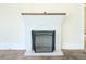 Close-up of a white-painted brick fireplace with decorative mantle at 1017 Mabbette St, Kissimmee, FL 34741