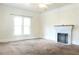 Light-filled living room featuring a decorative fireplace with white painted brick at 1017 Mabbette St, Kissimmee, FL 34741