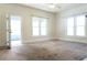 Airy living room with an open door leading to a sunroom at 1017 Mabbette St, Kissimmee, FL 34741