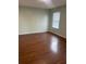 Bedroom with wood floors and natural light from the windows at 2906 Fox Squirrel Dr # 41, Kissimmee, FL 34741