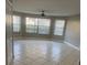 Spacious living room featuring tile floors and lots of natural light from large windows at 2906 Fox Squirrel Dr # 41, Kissimmee, FL 34741