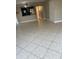 Bright living area with tile flooring, open to the kitchen, and a view of hallway at 2906 Fox Squirrel Dr # 41, Kissimmee, FL 34741