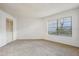 Bright bedroom with large window and neutral carpet at 3797 Atrium Dr # 3, Orlando, FL 32822