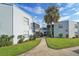 Exterior of building with walkway and landscaping at 3797 Atrium Dr # 3, Orlando, FL 32822