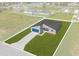 New home featuring a bright blue garage door, an open-concept layout, and a lush front lawn at 4683 Sw 136Th St, Ocala, FL 34473