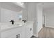 Modern bathroom with double vanity, white cabinets, and quartz countertop at 4683 Sw 136Th St, Ocala, FL 34473