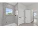 Modern bathroom featuring a marble-look shower and sleek fixtures at 4683 Sw 136Th St, Ocala, FL 34473