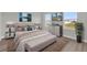 Beautifully staged bedroom features modern decor, a comfortable bed, and stylish furnishings at 4683 Sw 136Th St, Ocala, FL 34473