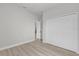 Bedroom features spacious closet and wood-look flooring at 4683 Sw 136Th St, Ocala, FL 34473