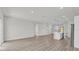 Open concept living space featuring kitchen with island and stainless steel appliances at 4683 Sw 136Th St, Ocala, FL 34473