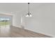 Open living room featuring recessed lighting, wood-look floors, and sliding glass doors at 4683 Sw 136Th St, Ocala, FL 34473