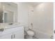 Clean bathroom with white vanity, bathtub, and tiled walls at 5161 Springrise Dr, Saint Cloud, FL 34772