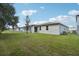 Home with a grassy backyard at 5186 Minneola Ln, Saint Cloud, FL 34772