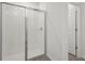 Clean bathroom with a shower stall and tiled walls at 5186 Minneola Ln, Saint Cloud, FL 34772