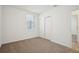 Bright bedroom with carpet flooring and double door closet at 5186 Minneola Ln, Saint Cloud, FL 34772