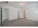 Spacious bedroom with carpet, multiple entry points and a closet at 5186 Minneola Ln, Saint Cloud, FL 34772