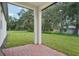 Brick paved patio, view of backyard and trees at 5186 Minneola Ln, Saint Cloud, FL 34772