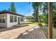 Patio, green door, and mature trees in the backyard at 2916 Oxford St, Orlando, FL 32803