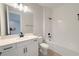 Well-lit bathroom with modern vanity, white cabinets, and a shower-tub combination at 3255 Roseville Dr, Apopka, FL 32712