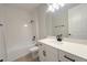 Modern bathroom featuring white cabinets, quartz countertop and shower/tub combination at 3255 Roseville Dr, Apopka, FL 32712