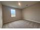 Cozy bedroom with neutral carpet, a window view and natural light at 3255 Roseville Dr, Apopka, FL 32712