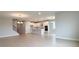 Open-concept living space featuring tile floors and a view of the modern kitchen at 3255 Roseville Dr, Apopka, FL 32712