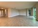 Spacious living room with tile floors and sliding glass doors to a back patio at 3263 Roseville Dr, Apopka, FL 32712