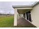 A covered back patio is a great place to relax and enjoy the view of the backyard at 3263 Roseville Dr, Apopka, FL 32712