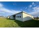 Wide view of backyard featuring well-maintained lawn and back patio at 3271 Roseville Dr, Apopka, FL 32712