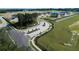 Community entrance featuring a statue and landscaping, surrounded by green spaces and new construction homes at 3279 Roseville Dr, Apopka, FL 32712