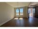 Inviting dining room with natural light, wood-look floors and chandelier at 3279 Roseville Dr, Apopka, FL 32712