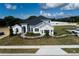 Beautiful single-Gathering home with stone accents, manicured lawn, and a walkway leading to the front door at 3279 Roseville Dr, Apopka, FL 32712