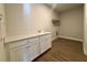 Convenient laundry room featuring a sink, cabinets, and a folding area at 3279 Roseville Dr, Apopka, FL 32712