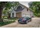 Two-story home featuring an attached two-car garage and lovely landscaping at 530 Estates Pl, Longwood, FL 32779