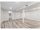 Finished basement with neutral walls, hardwood floors, support beams, and access to a closet at 1822 Se 8Th St, Ocala, FL 34471