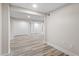 Finished basement with hardwood floors, white walls, and three closets at 1822 Se 8Th St, Ocala, FL 34471