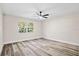 Bright, empty bedroom with lots of natural light and vinyl floors at 1822 Se 8Th St, Ocala, FL 34471