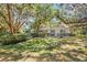 Charming single-story home with large front yard, mature trees, and manicured shrubs at 1822 Se 8Th St, Ocala, FL 34471