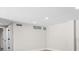 Spacious hallway with modern recessed lighting and neutral paint leads to bedrooms at 1822 Se 8Th St, Ocala, FL 34471