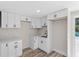 Eat-in kitchen features new white cabinets and sink with window overlooking outdoor area at 1822 Se 8Th St, Ocala, FL 34471