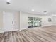 Bright living room featuring beautiful wood floors and large windows for natural light at 1822 Se 8Th St, Ocala, FL 34471